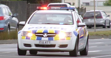 A police car with its siren on.
